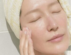 A Korean woman in her 40s enjoying a skincare ro