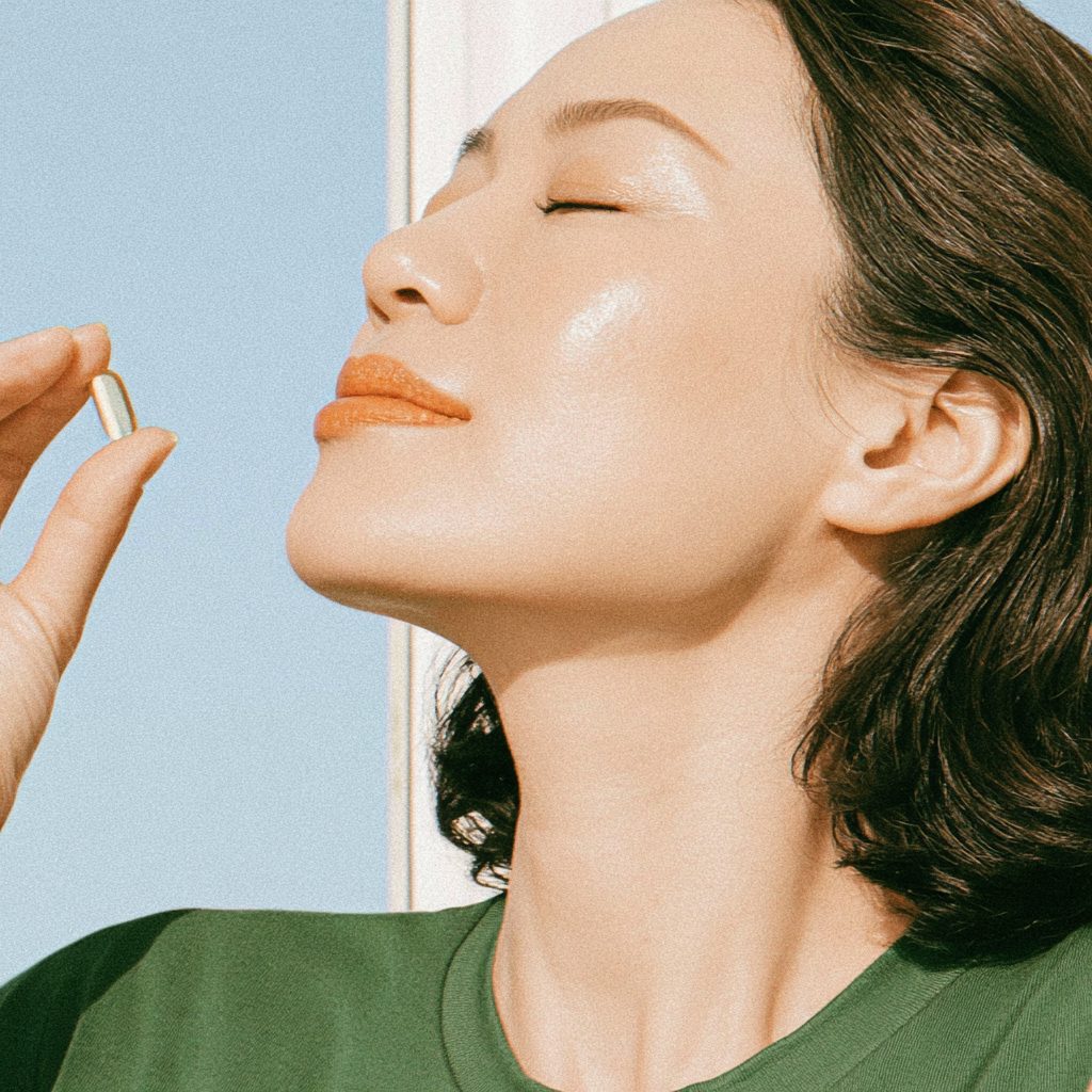 A Korean woman in her 40s enjoying an energy boo